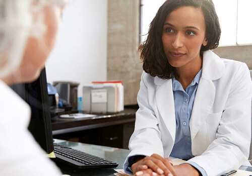 woman talking to a doctor