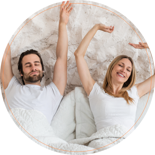 Man and woman waking up refreshed after sleep apnea treatment in Scottsdale