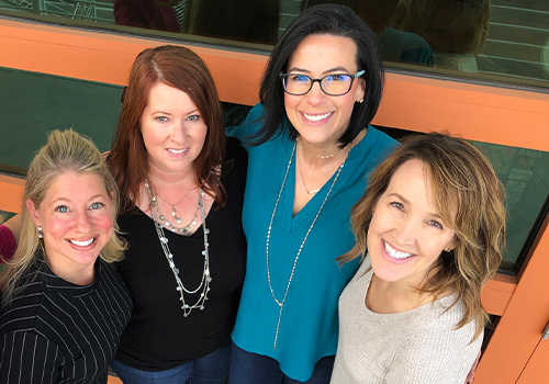 Doctor Layman smiling with three team members at GoTo Sleep Center Scottsdale