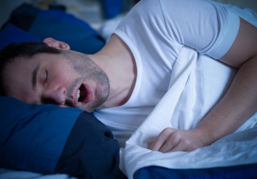 Man sleeping on his side with his mouth open