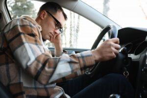 Man driving while drowsy. 