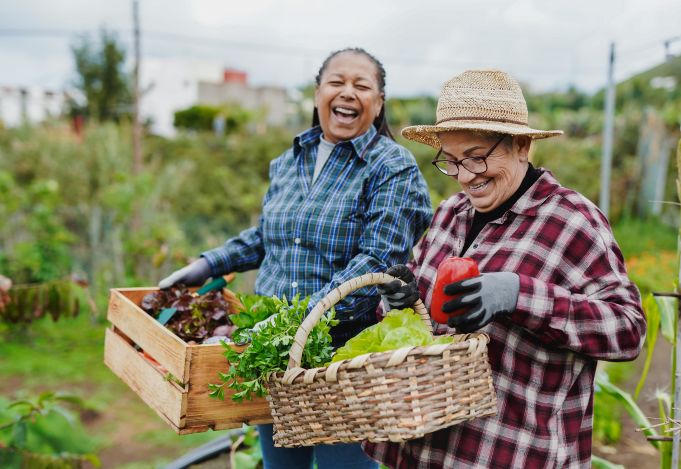 Two women gardening together